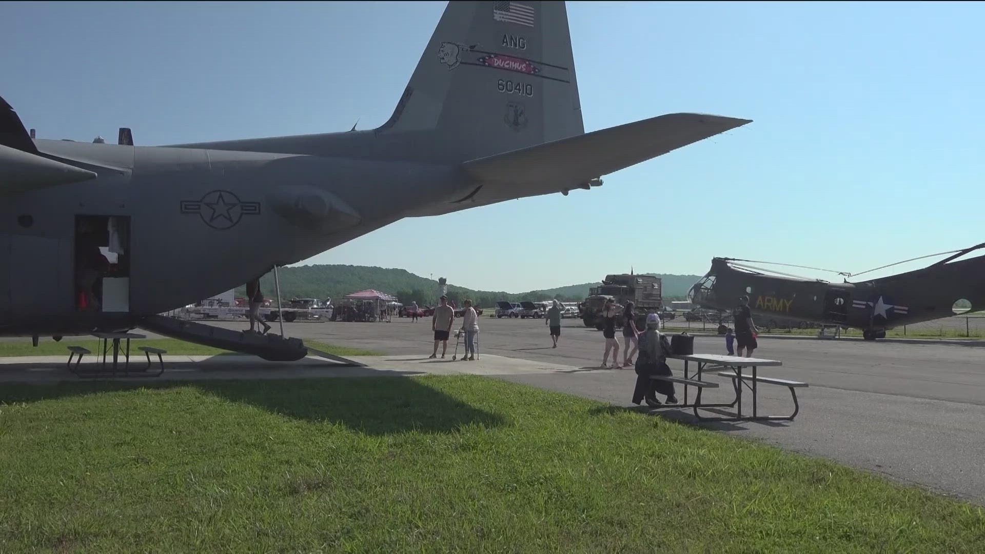 FAMILIES WALKED AMONGST HANGERS AND HOT RODS AT THIS YEAR'S WINGS AND WHEELS EVENT THIS MORNING IN FAYETTEVILLE...