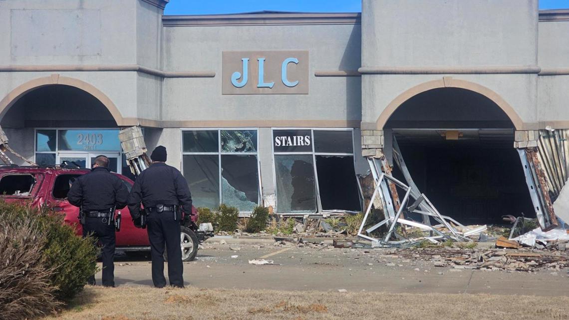 Three people hospitalized after car crashes into building in Rogers ...