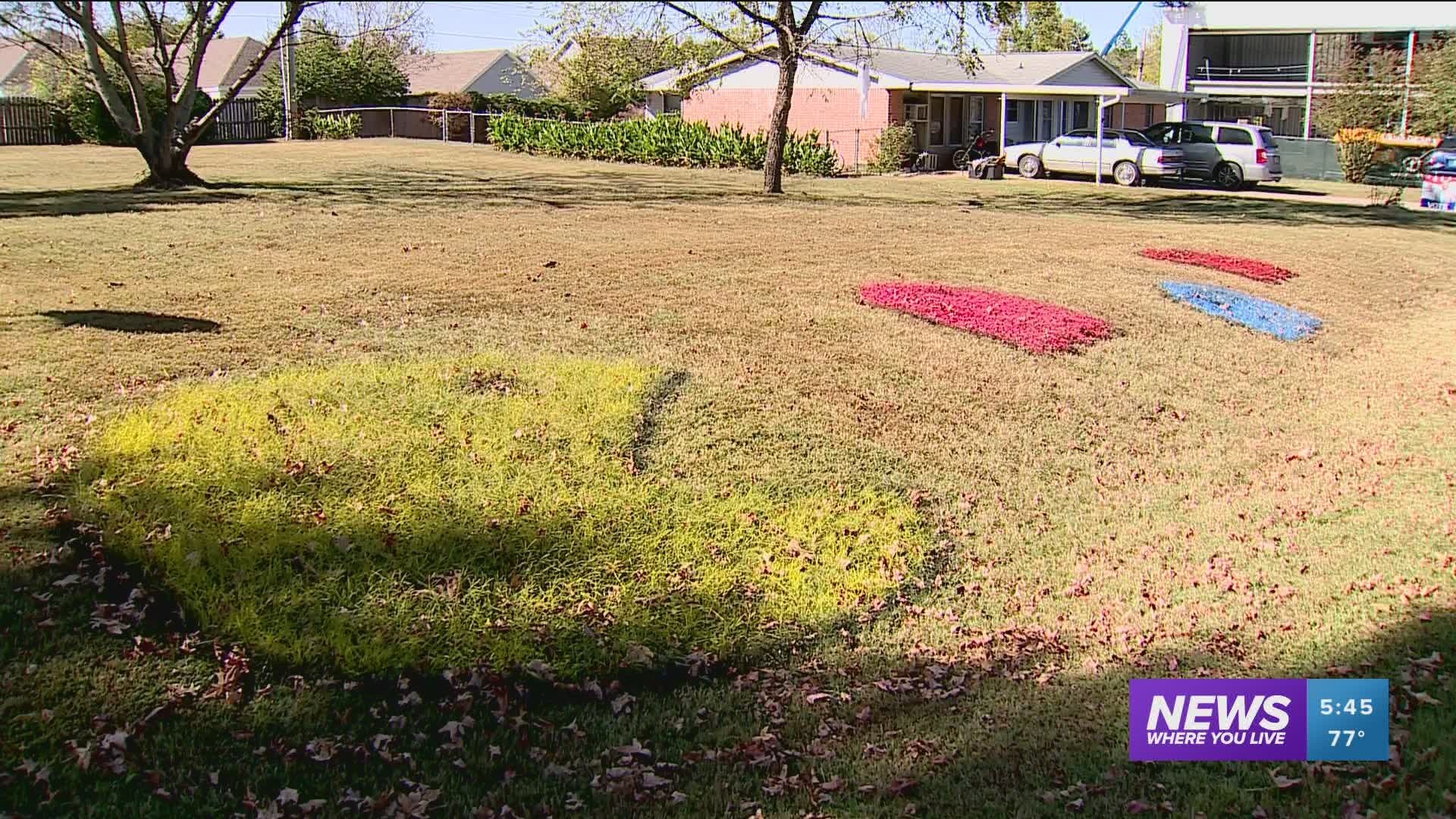 Jay Phillips created a Pac-Man themed artwork at in his yard on Cline Avenue with the help of his 12-year-old son.