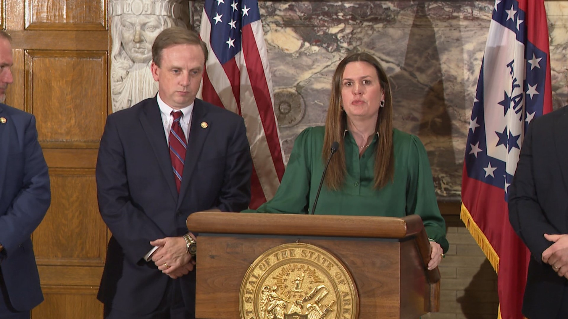 Gov. Sarah Huckabee Sanders signed into law a measure cutting individual and corporate income taxes in Arkansas by $124 million a year.