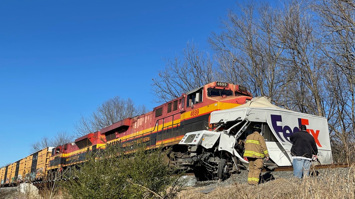 FedEx driver injured after delivery truck hit by train