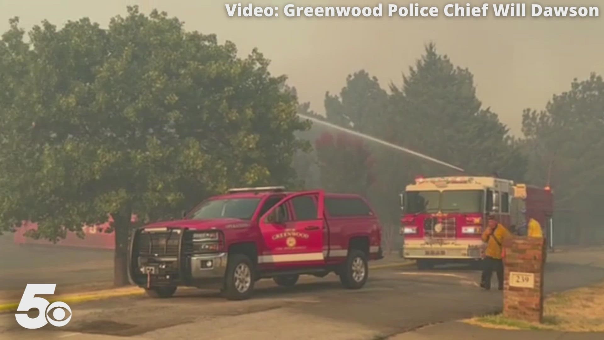 Emergency crews are working to put out a grassfire that is spreading from Fort Chaffee to Greenwood.