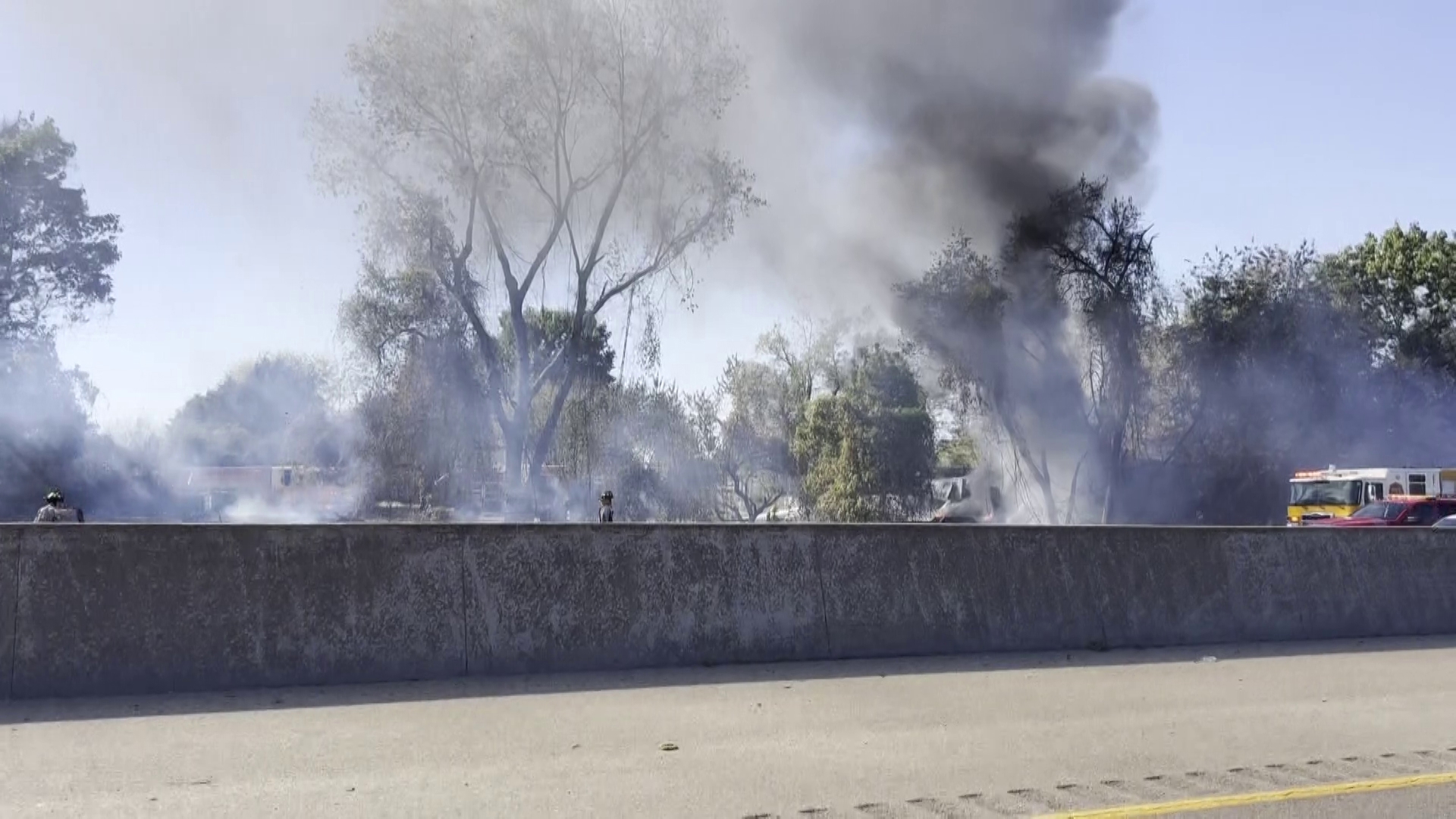 A grass fire sent plumes of smoke over I-49 on Oct. 7.