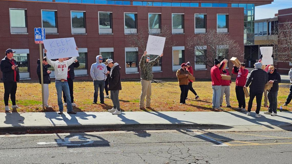 Fans gather outside U of A in protest of Silverfield hire