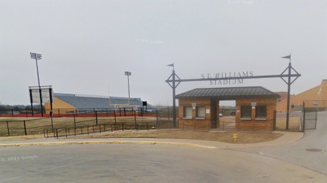 Football game suspended after reports of gun