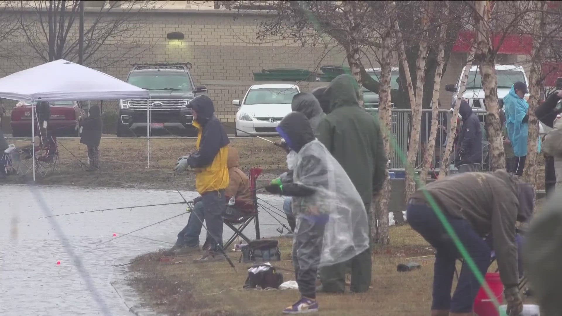 DESPITE THE RAIN AND CHILLY TEMPERATURES - FAMILIES STILL TURNED OUT THIS MORNING FOR TROUT DAY.