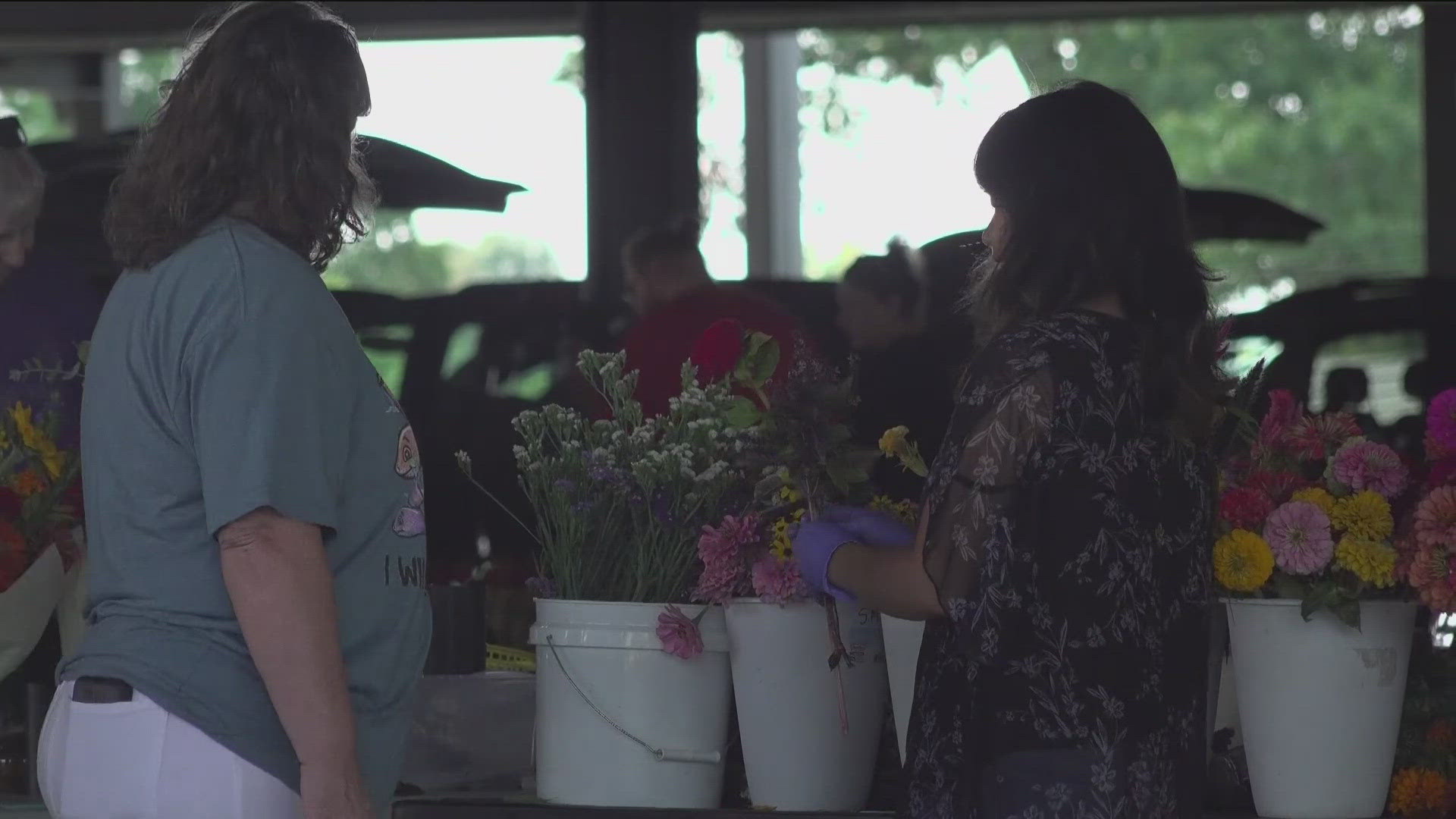 The market's previous location was impacted by the May 26 tornadoes. The market manager says vendors and visitors are loving their new location.