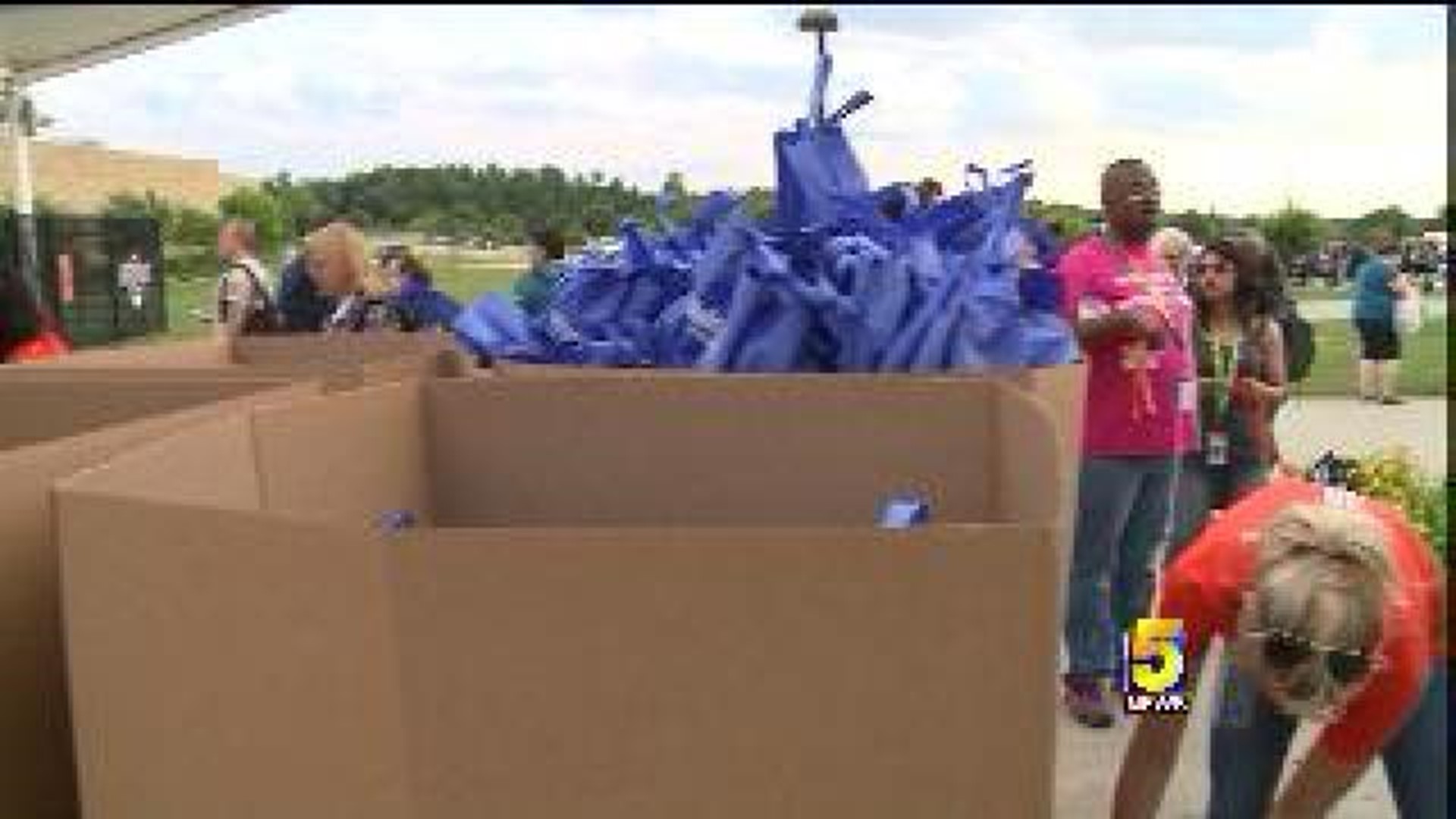Walmart Shareholders Pack Thousands Of Bags For Charity