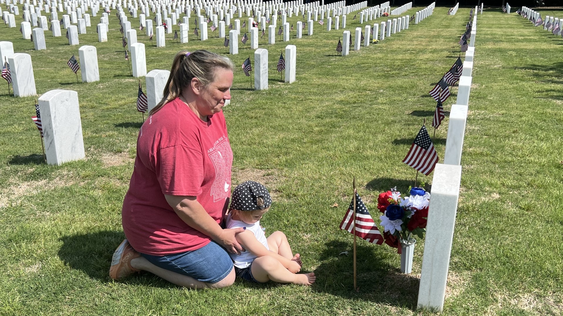 In preparation for Memorial Day, volunteers placed U.S .flags on headstones at Fayetteville National Cemetery on May 27, to honor fallen soldiers.