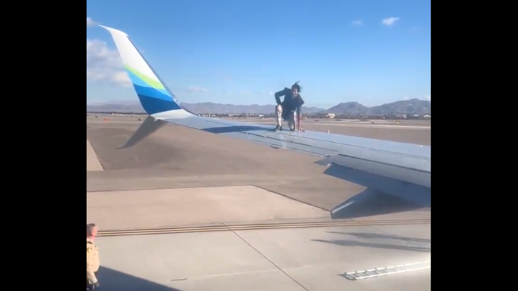 Trespasser climbs onto wing of a plane at Las Vegas airport