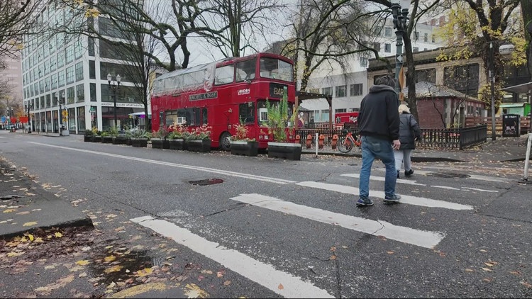 London double-decker bus bar parked on Burnside sees business increase downtown after slow post-COVID start