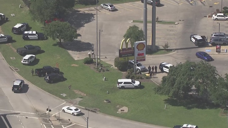 Heavy law enforcement presence at gas station along North Freeway at League Line Road
