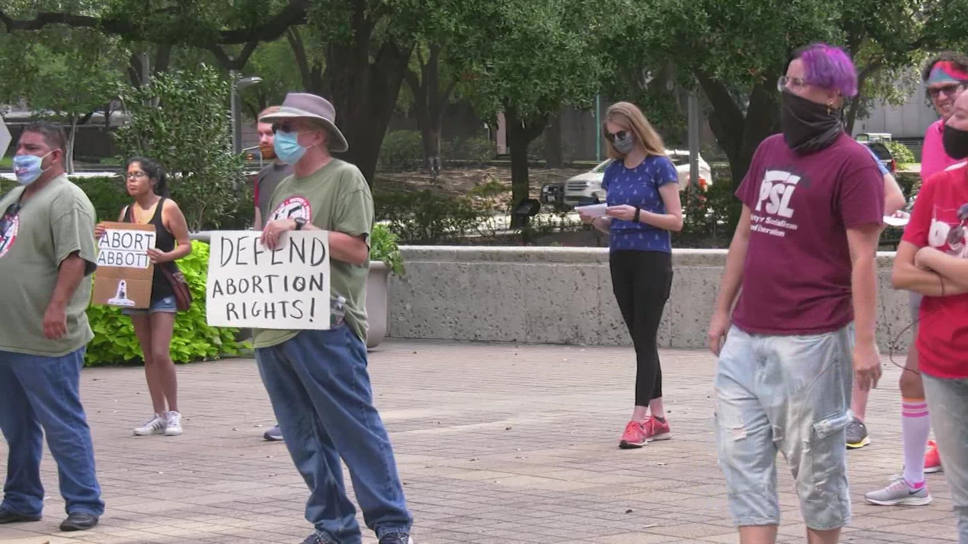 Dozens of protesters made their voices heard outside of Houston City Hall.