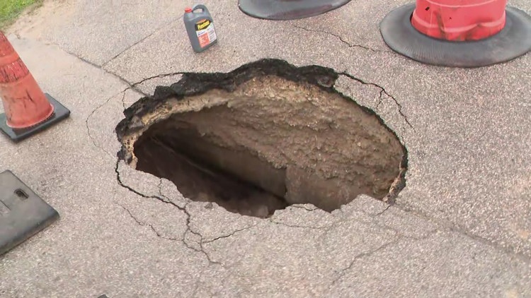 A Houston woman drove into a massive hole in the road and says the city should pay for her car's damage