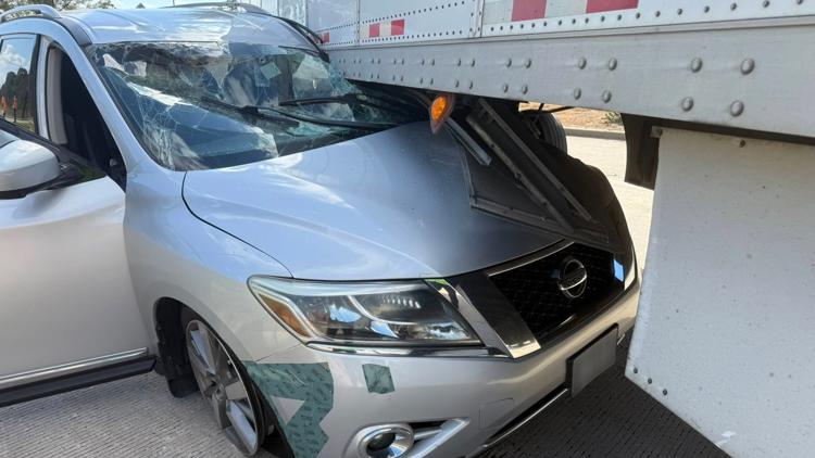 Driver manages to walk away after getting van wedged under 18-wheeler in Montgomery County
