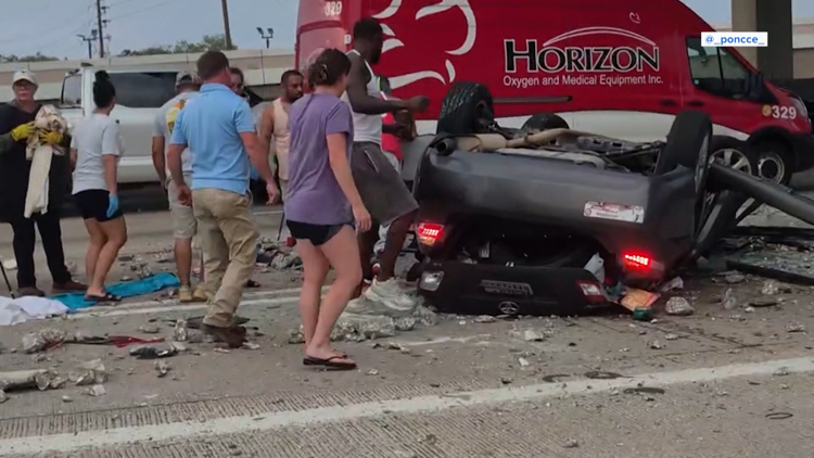 Bystanders rush to free women trapped in overturned car after major crash