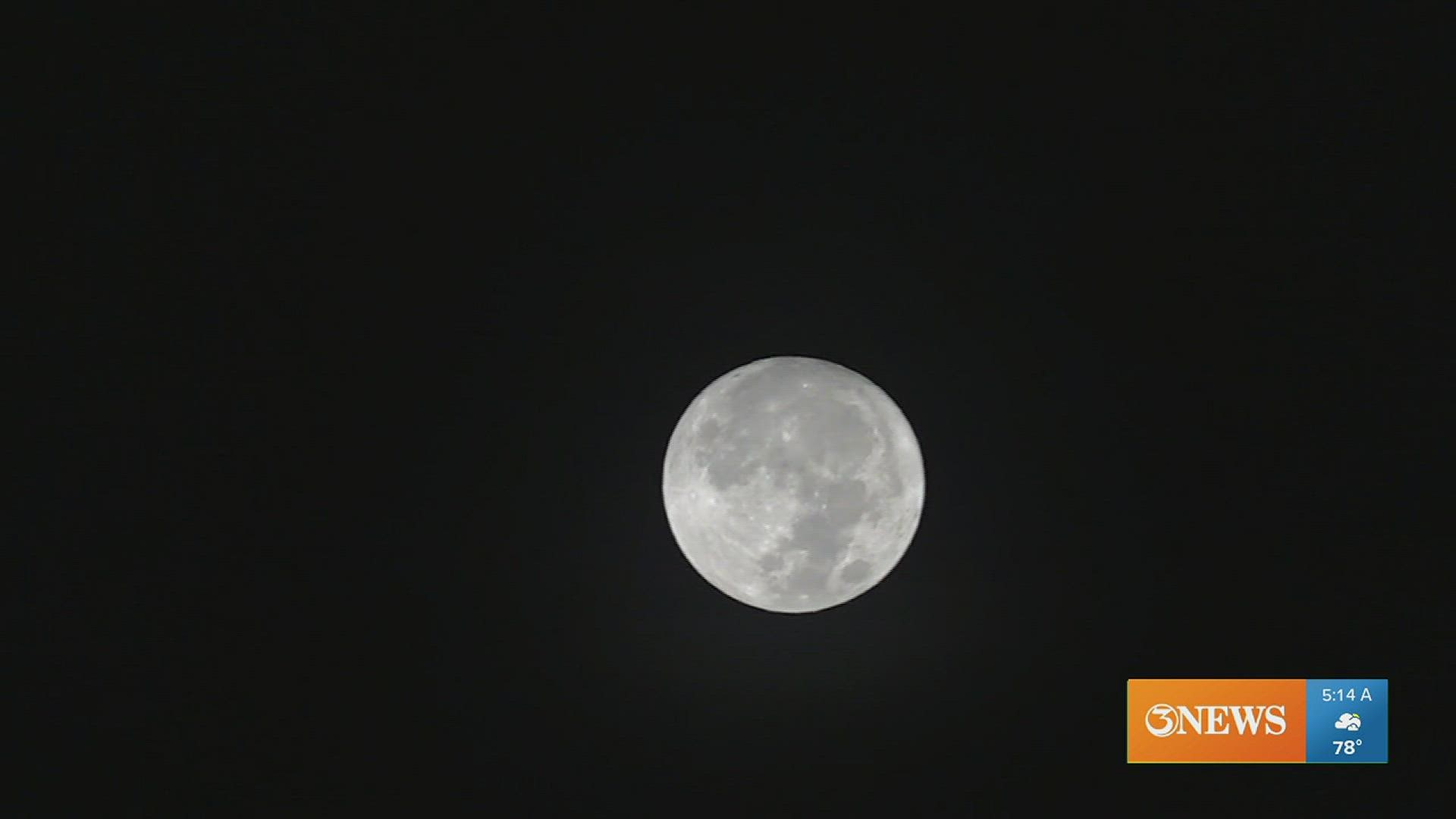 The moon was big and bright in the early morning sky Thursday.