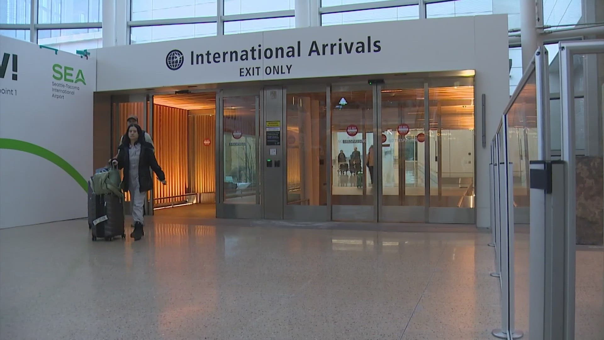 Another passenger on the flight says five people helped restrain the man as the flight, headed for Seattle, returned to Tokyo.