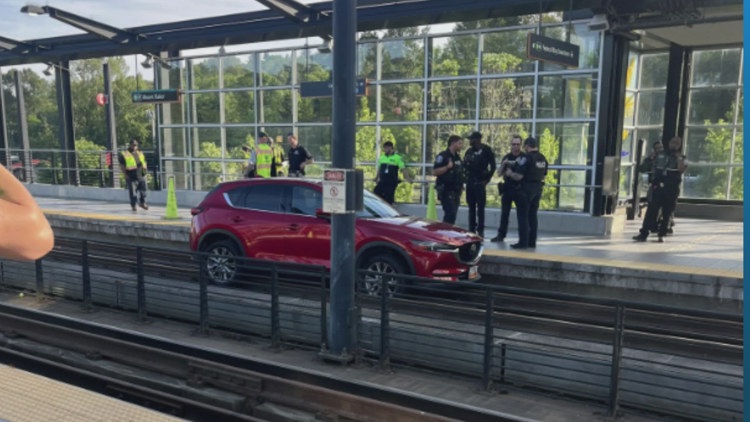 Car drives onto elevated light rail tracks in Seattle