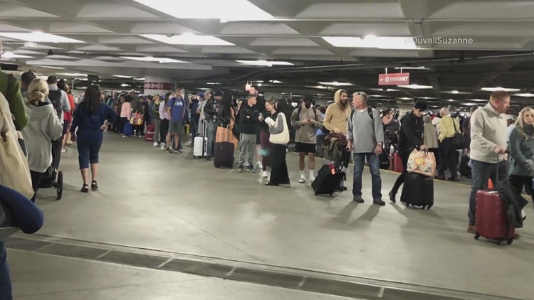 'Very unusual' Seattle airport experience forces long line of travelers into parking garage