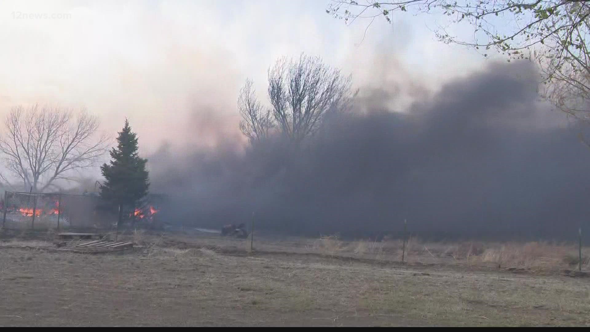 Crews are working to contain a fast-moving wildfire that continues to threaten homes in Northern Arizona.