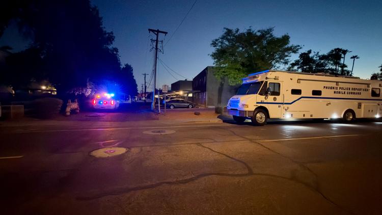 Suspect in custody after man found dead with gunshot wound inside crashed vehicle in Phoenix