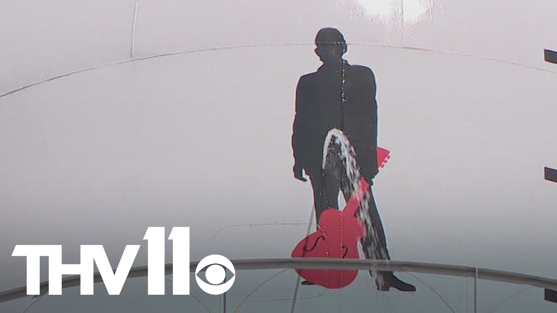 The water tower in Kingland, Arkansas has sprung a leak in a delicate spot...right on the groin of a Johnny Cash silhouette.