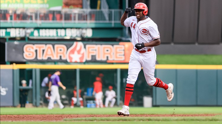 Aquino slam helps Reds rout Rockies for doubleheader split