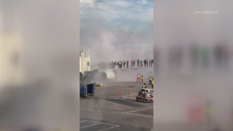 American Airlines plane catches fire at Denver airport