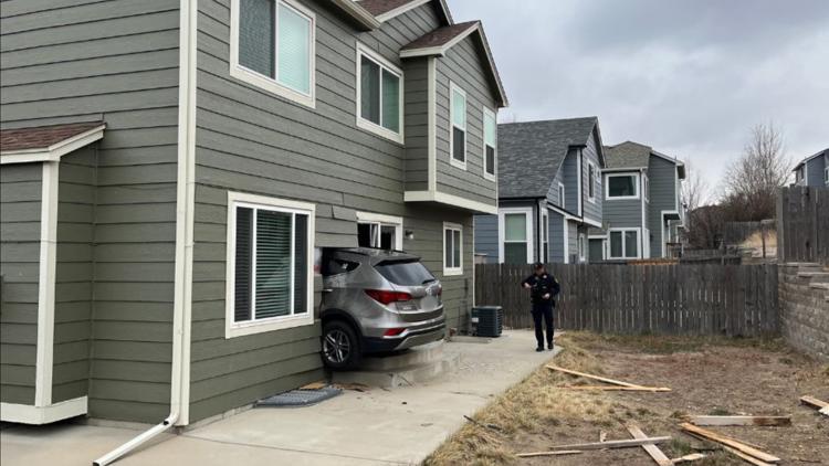 Driver ends up inside Douglas County home after crash