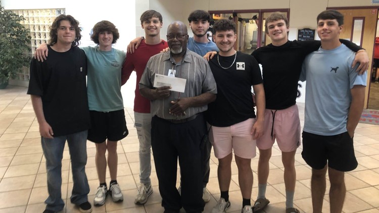 Students present $10K check to beloved custodian, father of 5 who recently lost his wife