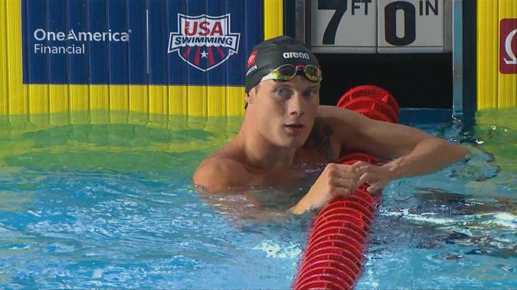 Professional athlete McCarty swims at high speed during 50m backstroke championship event
