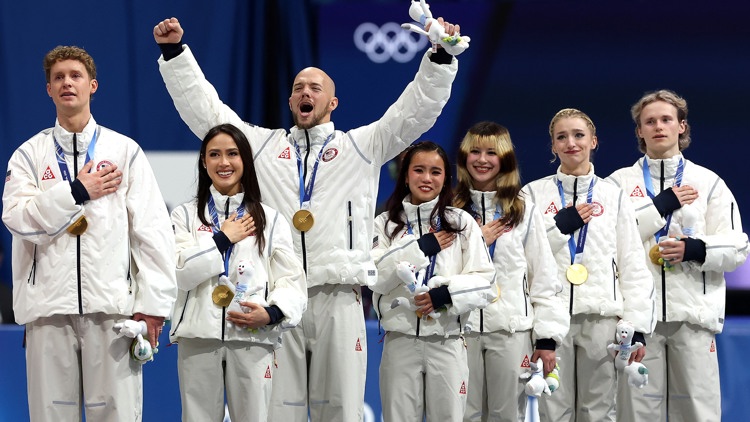 Team USA receives their gold medals in the team event