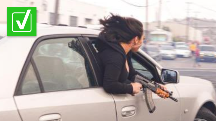 Yes, the photo of a woman holding an AK-47 in San Francisco is real