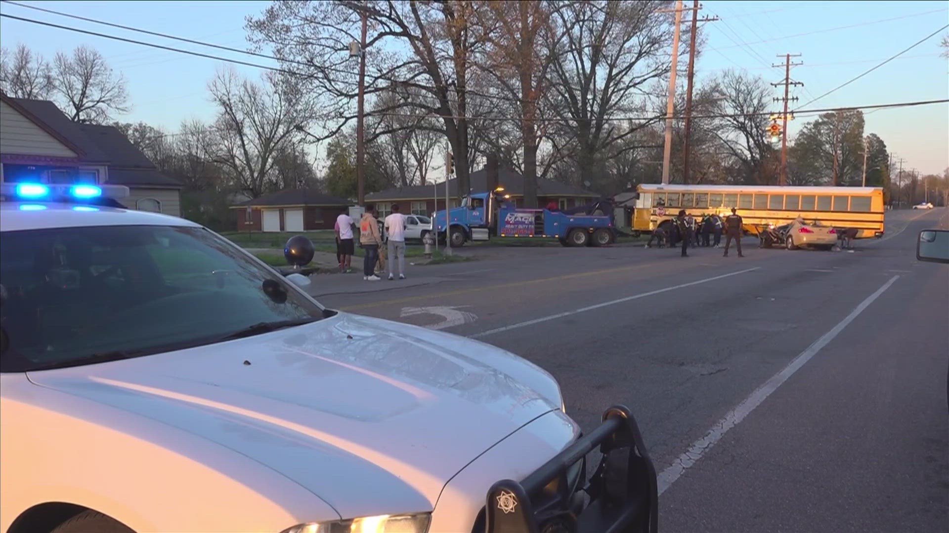 Police say no children were hurt after a two-vehicle crash with a school bus took place during rush hour traffic.