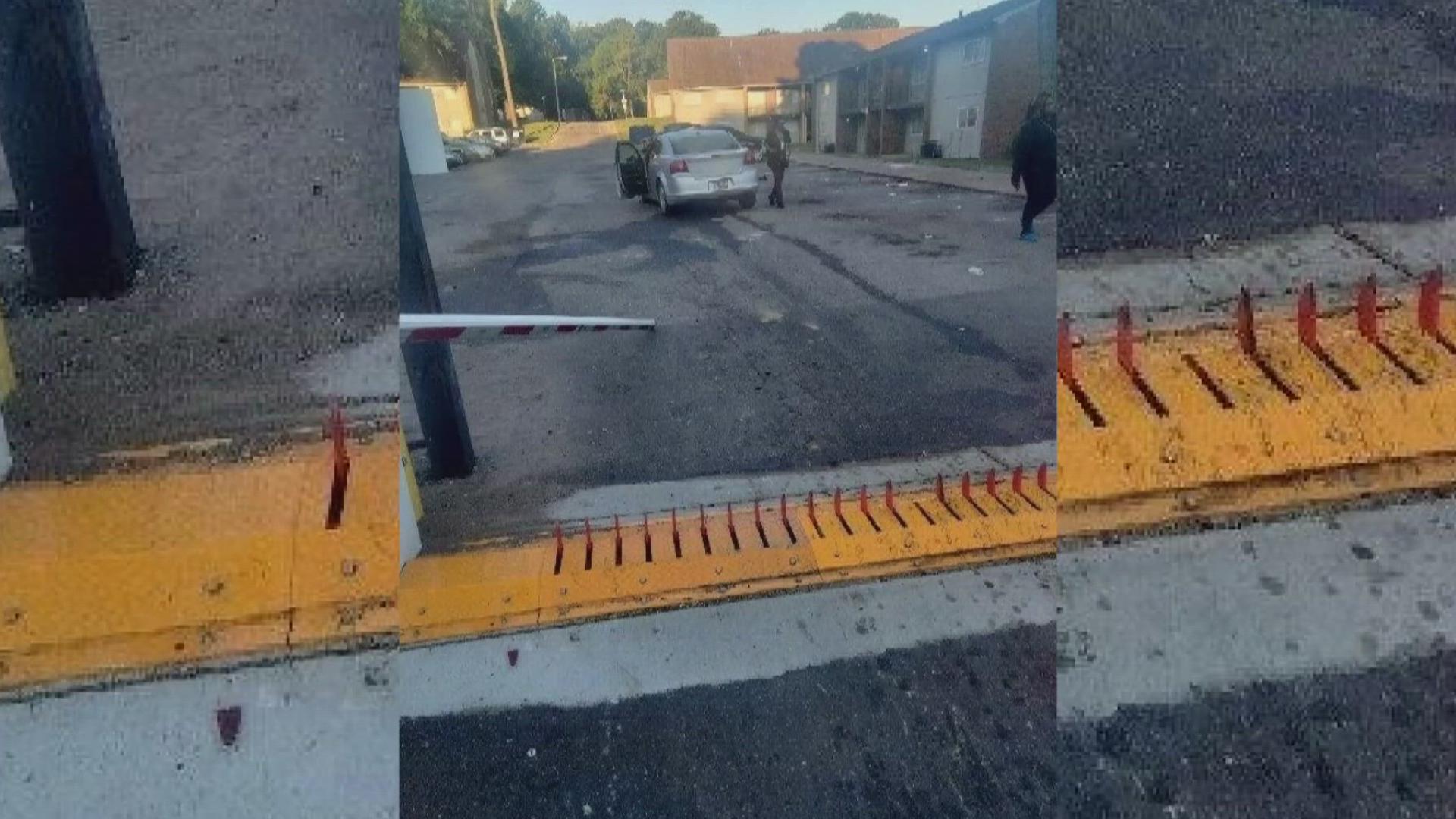 Security spikes meant to prevent unauthorized entry caused damage to a car when the entrance gate was left open, leading at least one driver to hit them.