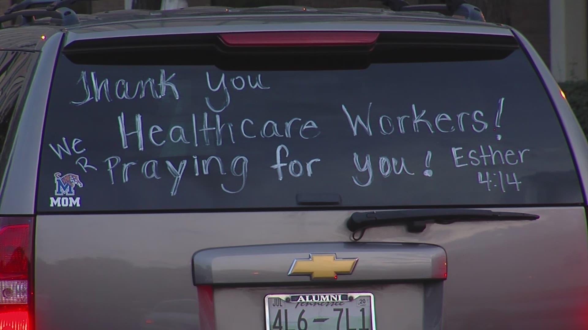 The prayer and songs were held in the hospital's parking lot Monday night.