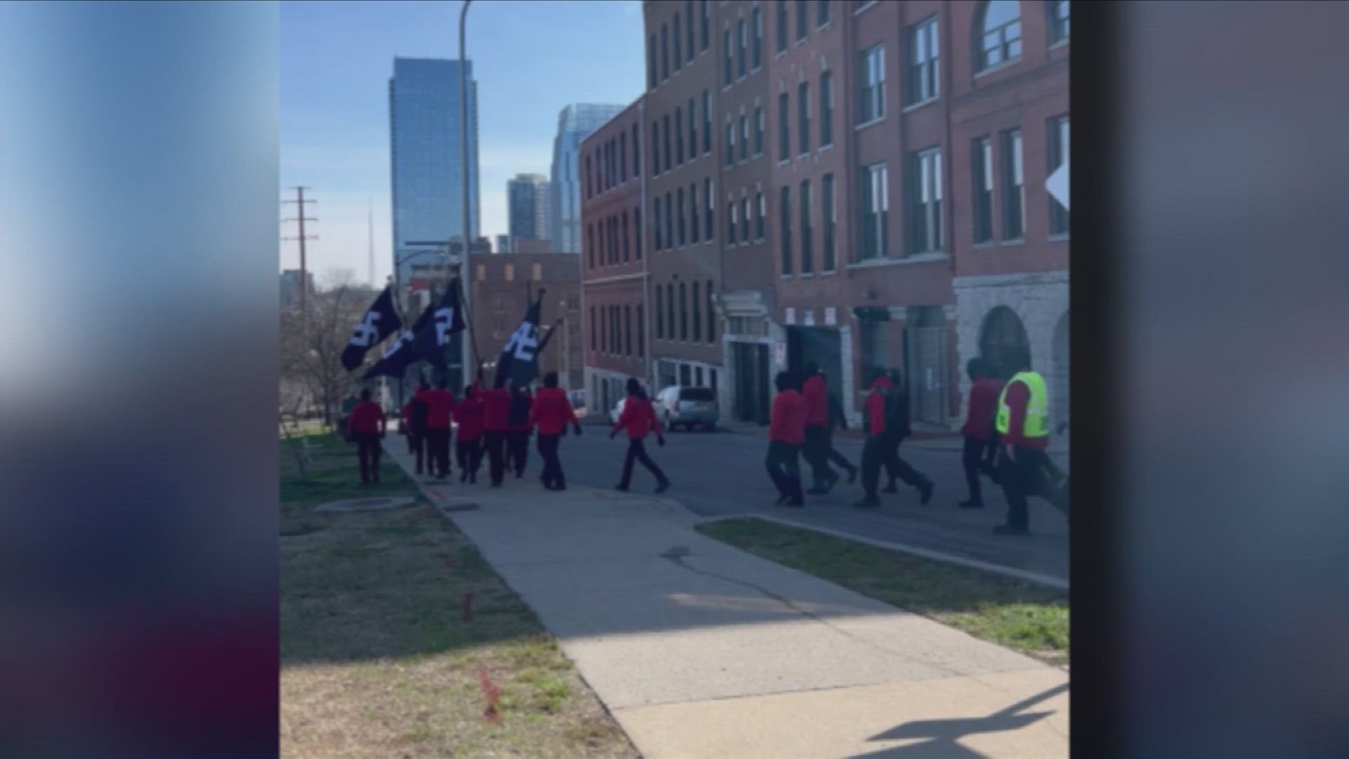 On Saturday, a large group of people hiding their faces but displaying swastika flags marched through Downtown Nashville as lawmakers in the area took notice.