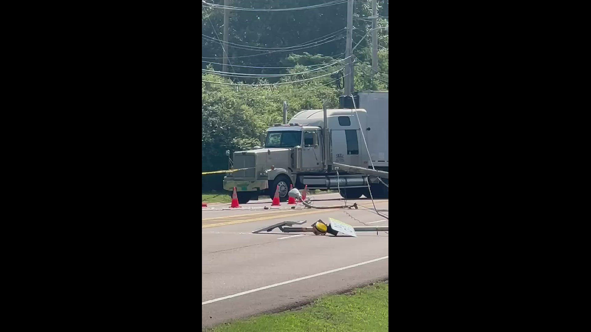 Poplar Ave in Germantown was shut down in both directions just east of Poplar Estates Tuesday morning after an 18-wheeler hit a power line.