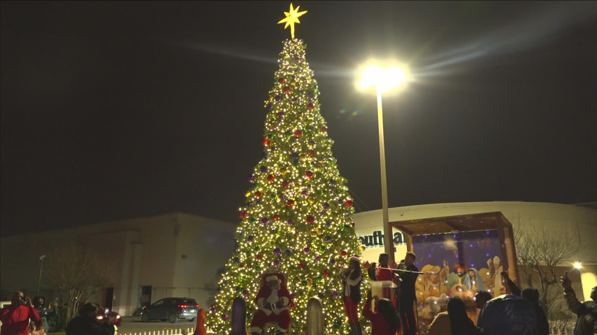 The new tree was purchased through a community fundraiser after backlash over a first tree.