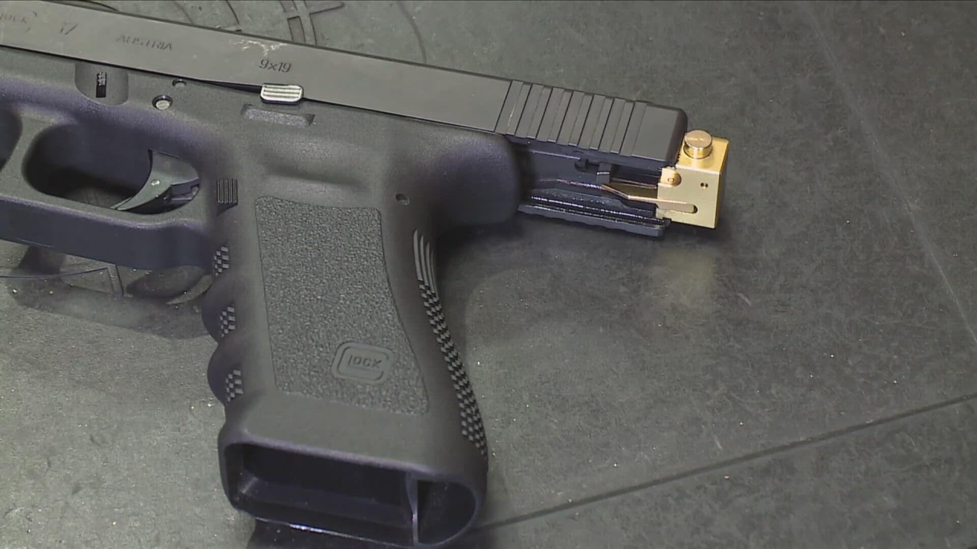 The Department of Justice said four people were arrested for possessing a Glock switch.