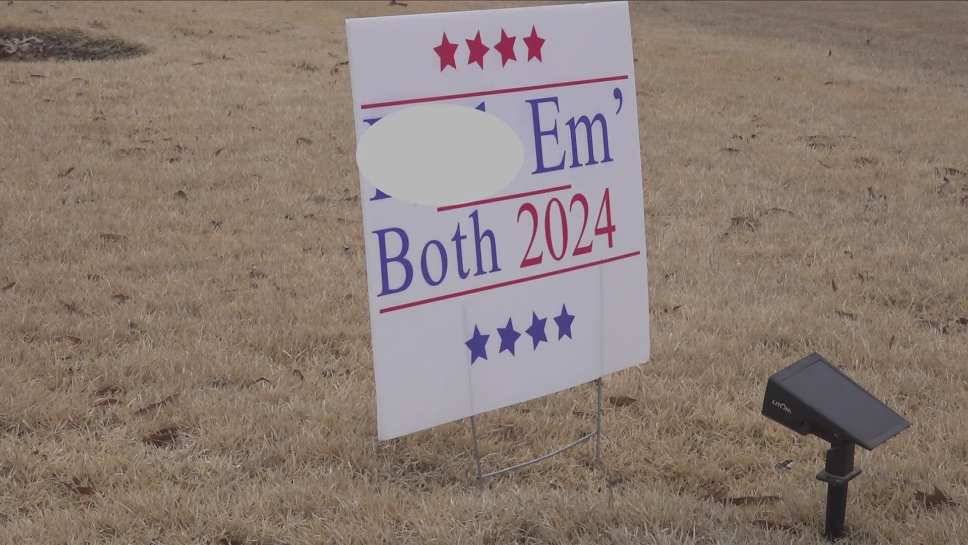 The City of Lakeland is settling with a resident who’s been battling fines for months over profane signs in her front yard, including one referencing the election.