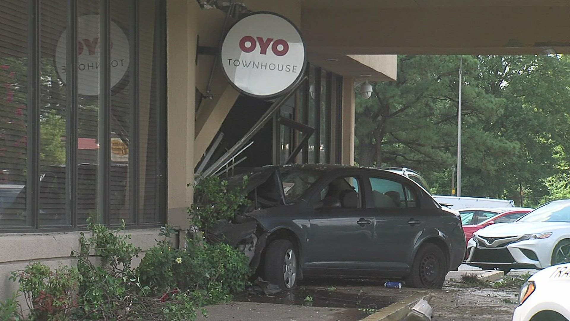Damage to the front of the hotel and the 4-door sedan that smashed into it could be seen from the road.