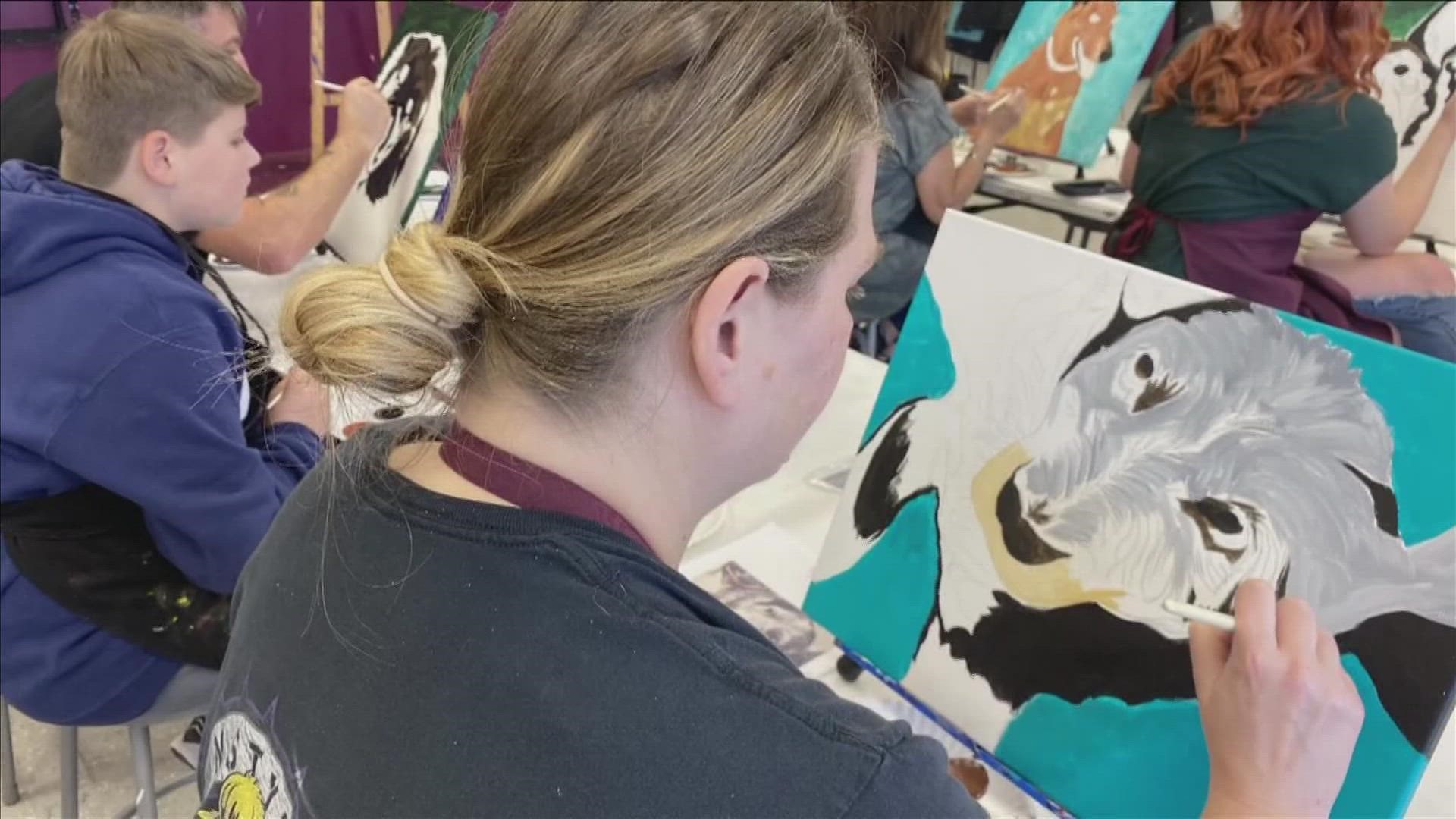 As service dogs can cost up to $30,000 for training, national studio franchise "Painting with a Twist" offered a fundraiser to each location, including Olive Branch.