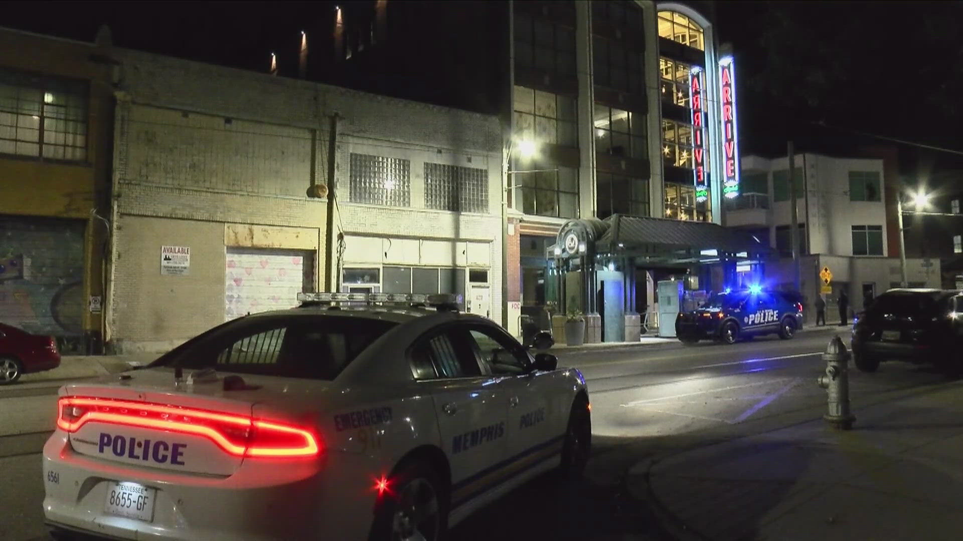 The shooting left one woman standing outside of the ARRIVE Memphis hotel in non-critical condition.