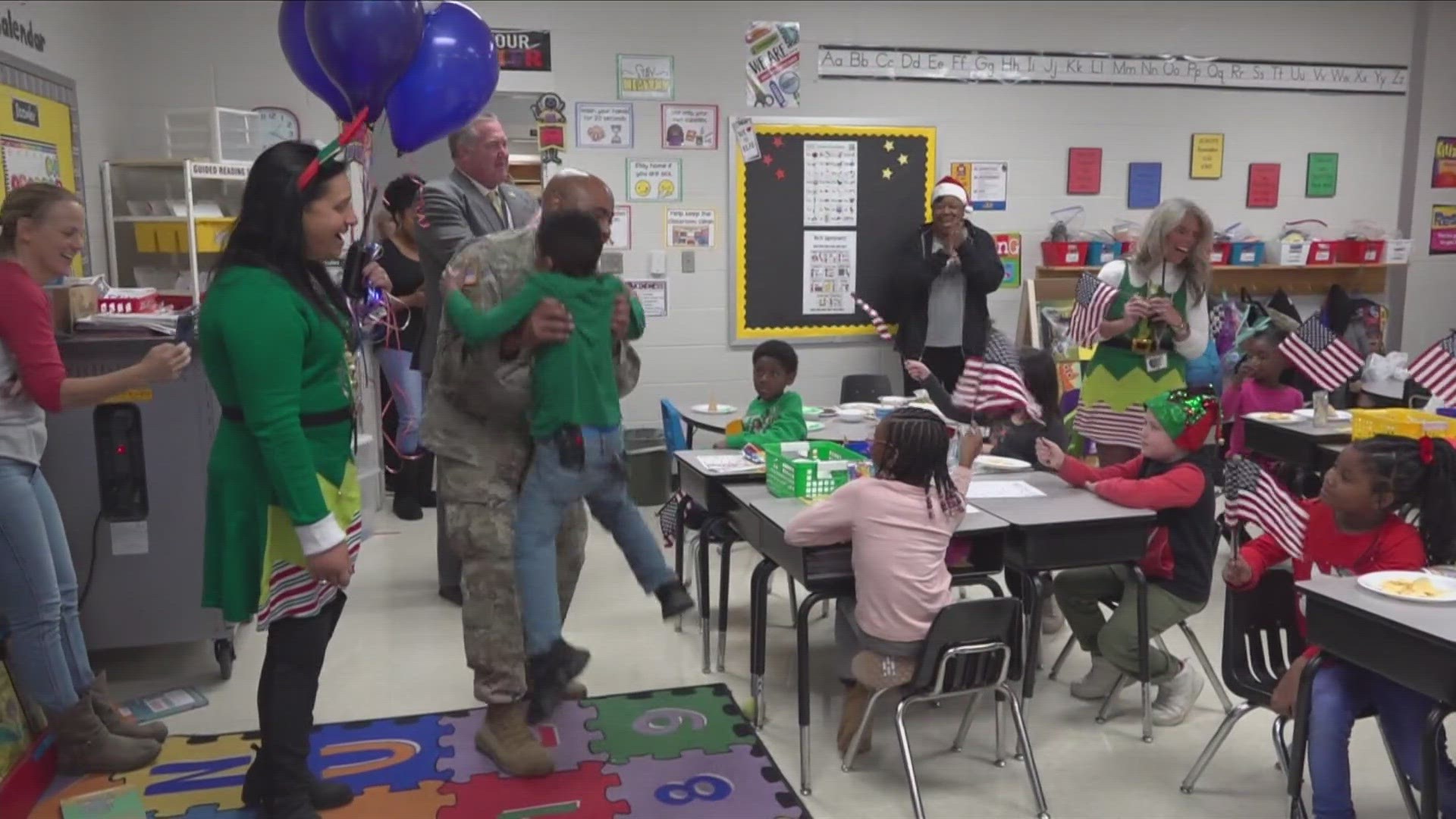 U.S. Army Captain Travis Kelly surprised 7-year-old Langston at Millington Primary School as teachers and classmates cheered.