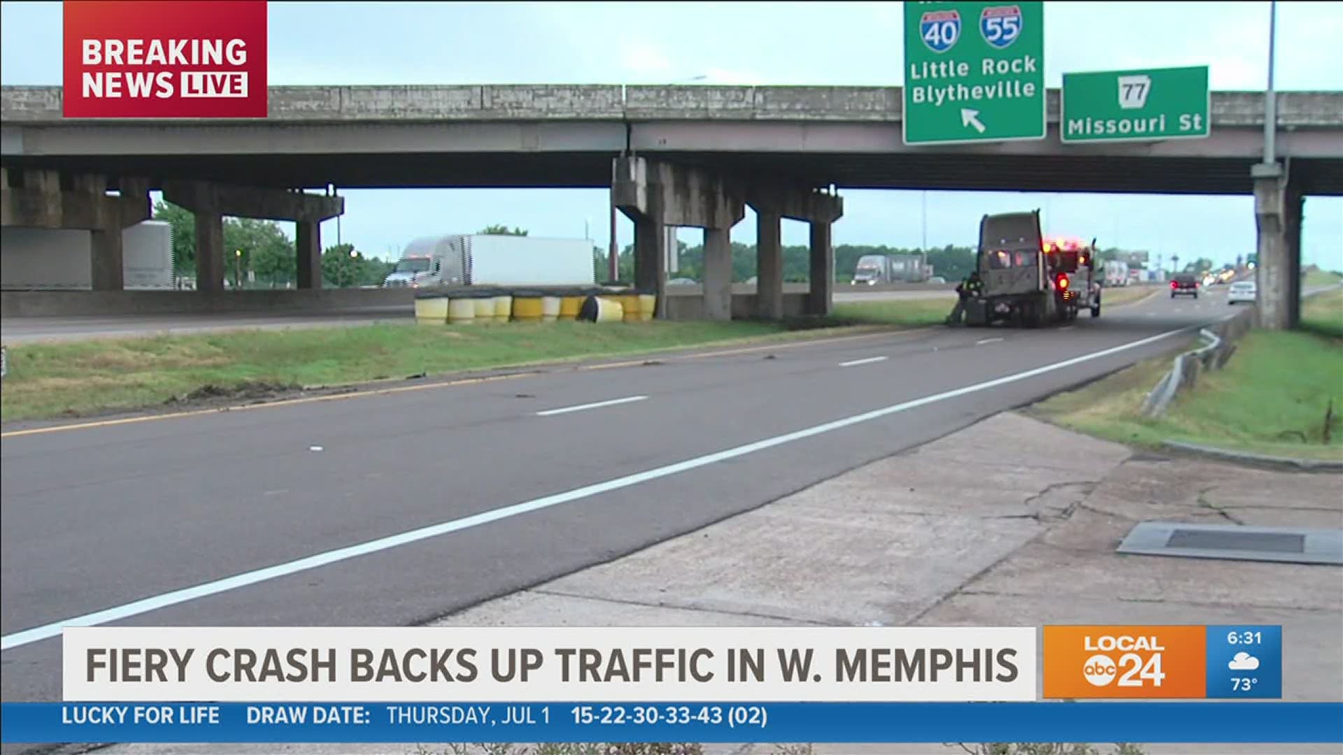 A semi flipped on its side and caught fire, causing a major backup in West Memphis Friday morning.