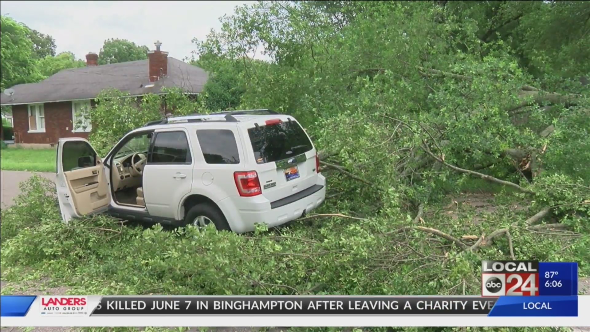 Parked truck potentially saves life of driver by blocking falling tree