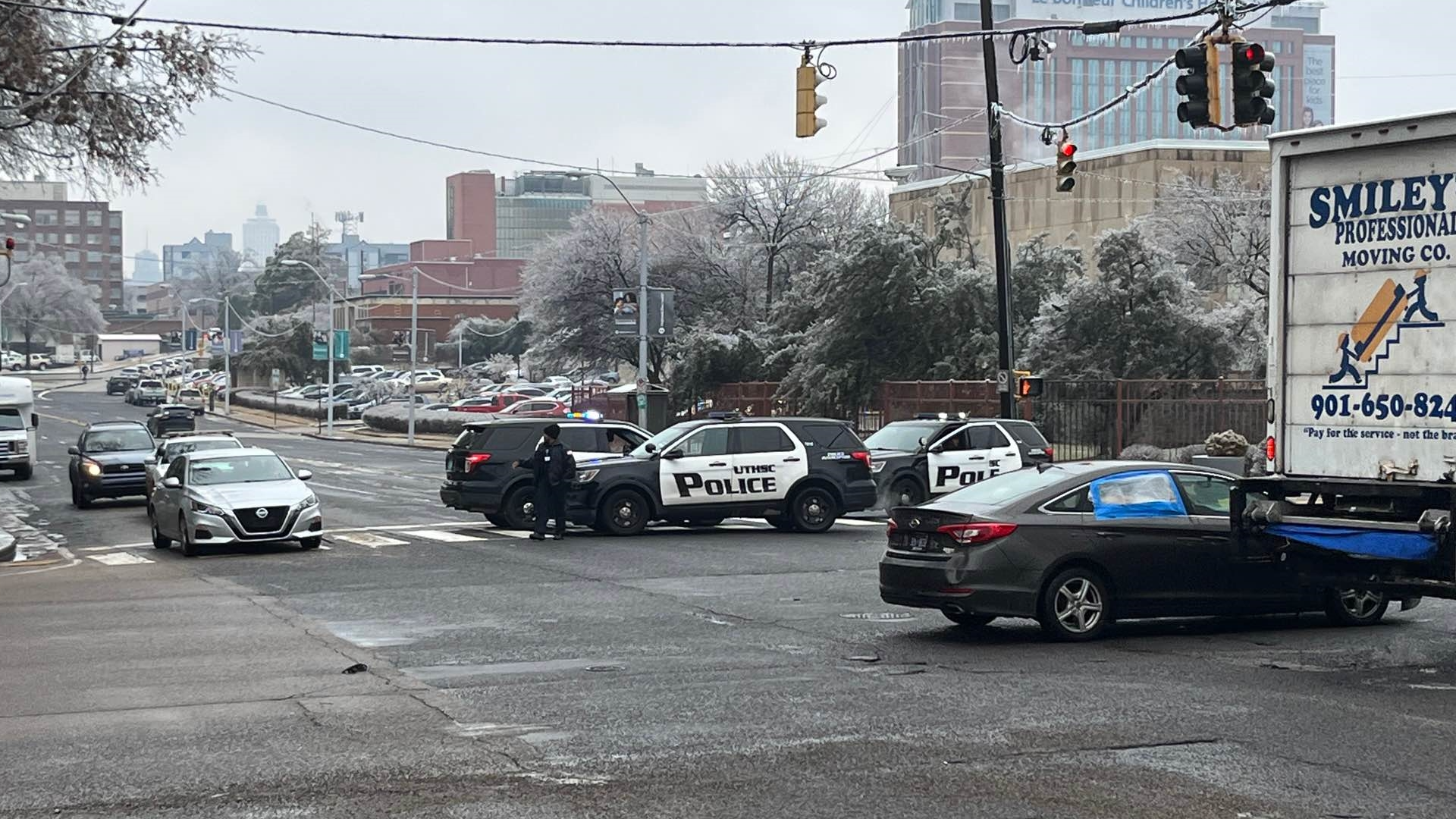 Memphis police officer injured, 1 dead in shooting near library ...