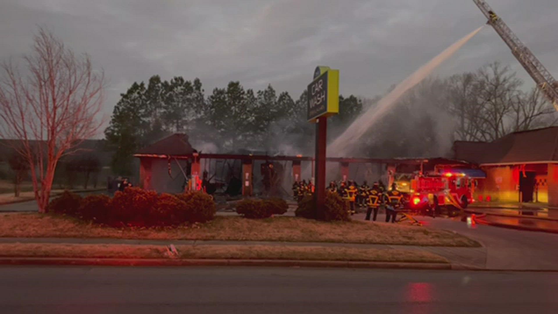 A car on fire spread to the structure of the car wash